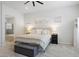 Bright main bedroom with neutral tones, a comfortable bed and an ensuite bathroom at 8503 Estes Park Ave, Littleton, CO 80125