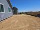 View of the large backyard awaiting landscaping, offering potential for outdoor living at 6034 Keyser Pl, Brighton, CO 80601