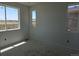 Bedroom with multiple windows offering natural light and views of the surroundings at 6034 Keyser Pl, Brighton, CO 80601