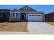 Charming single-story home features a two-car garage and classic architectural details at 6034 Keyser Pl, Brighton, CO 80601