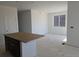 Bright living area with large window, ready for flooring and decor at 6034 Keyser Pl, Brighton, CO 80601