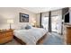 Inviting bedroom boasts ample natural light, a work area, and a door leading to a balcony, creating a serene space at 720 Columbine Rd # B, Breckenridge, CO 80424