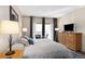 Inviting bedroom boasts ample natural light, a work area, and a door leading to a balcony, creating a serene space at 720 Columbine Rd # B, Breckenridge, CO 80424