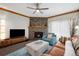 Bright living room with fireplace and balcony access, perfect for relaxation at 720 Columbine Rd # B, Breckenridge, CO 80424