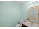 Clean half bathroom featuring a vanity with a sink and a toilet at 1212 S Emery St # C35, Longmont, CO 80501