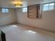 Spacious basement with large windows and built in shelving at 209 Reed St, Lakewood, CO 80226