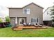 Inviting backyard features a wooden deck, chairs, lounge chairs, and ample lawn space at 3101 Goldeneye Pl, Superior, CO 80027