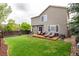 Backyard features a grassy yard and a wooden deck with lounge chairs at 3101 Goldeneye Pl, Superior, CO 80027