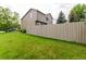 Expansive backyard with lush green lawn and tall privacy fence, perfect for outdoor activities at 3101 Goldeneye Pl, Superior, CO 80027