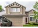 Two-story home boasts well-kept lawn, neutral siding, and attached two-car garage with driveway at 3101 Goldeneye Pl, Superior, CO 80027