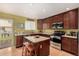 Well-equipped kitchen with island, stainless appliances, and bright, airy atmosphere at 3101 Goldeneye Pl, Superior, CO 80027