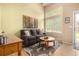 Cozy living room with high ceilings, abundant natural light, and comfortable seating arrangement at 3101 Goldeneye Pl, Superior, CO 80027