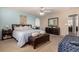Serene main bedroom featuring a king-size bed, ceiling fan, and neutral color palette at 3101 Goldeneye Pl, Superior, CO 80027