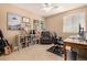 Well-organized office space features a desk, chair, recliner, and bookshelf for storage at 3101 Goldeneye Pl, Superior, CO 80027