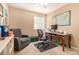 Comfortable office space features a desk, chair, recliner, and shelf for storage at 3101 Goldeneye Pl, Superior, CO 80027