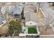 Aerial view of backyard featuring patio, turf, deck, and outdoor furniture at 8001 W 57Th Ave, Arvada, CO 80002
