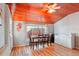 Cozy dining room with wood ceiling and floors, perfect for Gathering meals at 8001 W 57Th Ave, Arvada, CO 80002