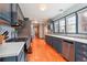 Modern kitchen with stainless appliances, ample counter space, and updated cabinets at 8001 W 57Th Ave, Arvada, CO 80002