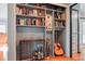 Built-in shelving unit with decorative items, and a guitar at 8001 W 57Th Ave, Arvada, CO 80002