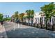 Vibrant street view with outdoor dining, showcasing local shops and restaurants in a lively neighborhood at 8001 W 57Th Ave, Arvada, CO 80002