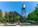 Scenic view of Olde Town Arvada water tower, featuring lush greenery and a charming gazebo for community gatherings at 8001 W 57Th Ave, Arvada, CO 80002