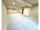 Spacious finished basement with neutral carpet, lighting, and ample storage at 12743 W Bowles Pl, Littleton, CO 80127