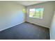 Carpeted bedroom with a large window allows for ample natural light at 12743 W Bowles Pl, Littleton, CO 80127
