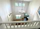 Open entryway with high ceilings and a chandelier provides natural light into the living spaces at 12743 W Bowles Pl, Littleton, CO 80127