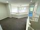 Upper landing area with neutral paint and carpet leads to the bedrooms and bathrooms at 12743 W Bowles Pl, Littleton, CO 80127