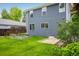 Grassy backyard with a garden and lovely landscaping at 1672 Maccullen Dr, Erie, CO 80516