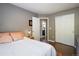 Neutral bedroom with hardwood floors, closet, and ensuite access at 1672 Maccullen Dr, Erie, CO 80516