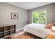 Bedroom with hardwood floors, a neutral color palette, and a large window for natural light at 1672 Maccullen Dr, Erie, CO 80516