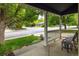 Inviting front porch view with seating and landscaped yard at 1672 Maccullen Dr, Erie, CO 80516