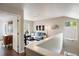 Second story living room with desk, sofa, and natural lighting at 1672 Maccullen Dr, Erie, CO 80516
