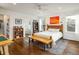 Spacious main bedroom with hardwood floors, ceiling fan and ensuite bathroom at 1672 Maccullen Dr, Erie, CO 80516