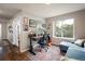 Bright home office with modern desk, comfortable seating, and beautiful natural light at 1672 Maccullen Dr, Erie, CO 80516