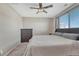 Primary bedroom with ceiling fan and window at 15119 E 119Th Ave, Commerce City, CO 80603