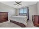 Primary bedroom with ceiling fan and large bed at 15119 E 119Th Ave, Commerce City, CO 80603