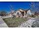 Brick ranch home with attached garage and landscaped yard at 15119 E 119Th Ave, Commerce City, CO 80603