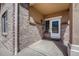 Inviting front entrance with brick facade and a white door at 15119 E 119Th Ave, Commerce City, CO 80603