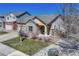 Brick ranch home with landscaped yard at 15119 E 119Th Ave, Commerce City, CO 80603