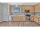 Kitchen with light wood cabinets, stainless steel appliances and granite countertops at 15119 E 119Th Ave, Commerce City, CO 80603