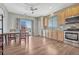 Bright kitchen features a dining area and access to a deck at 15119 E 119Th Ave, Commerce City, CO 80603