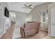 Spacious living room with vaulted ceiling, fireplace and large sectional sofa at 15119 E 119Th Ave, Commerce City, CO 80603