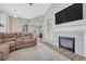Spacious living room with vaulted ceiling, fireplace and large sectional sofa at 15119 E 119Th Ave, Commerce City, CO 80603