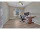 Home office with built-in shelving and a large wood desk at 15119 E 119Th Ave, Commerce City, CO 80603