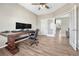 Home office with built-in shelving and a large wood desk at 15119 E 119Th Ave, Commerce City, CO 80603