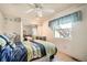 Cozy bedroom with carpet floors, ceiling fan and a window bringing in natural light at 3633 S Ingalls St, Denver, CO 80235