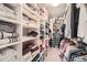 Organized walk-in closet with ample shelving and hanging space for clothes and accessories at 3633 S Ingalls St, Denver, CO 80235
