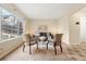 Bright living room with neutral tones and large window offering ample natural light at 3214 S Bahama St, Aurora, CO 80013